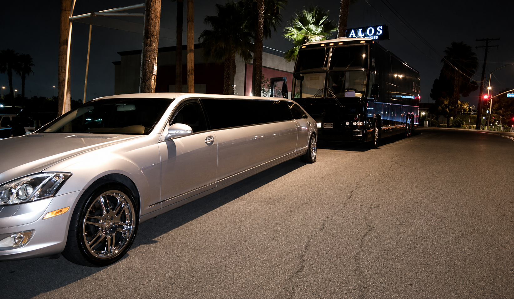 Stretch limousine and executive party coach staged at night before a Southern California event